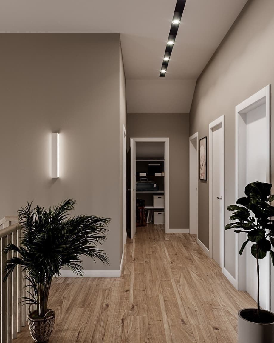 Modern hallway with smooth neutral walls and crisp white trim