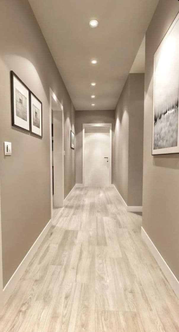 Long residential hallway finished in warm neutral paint