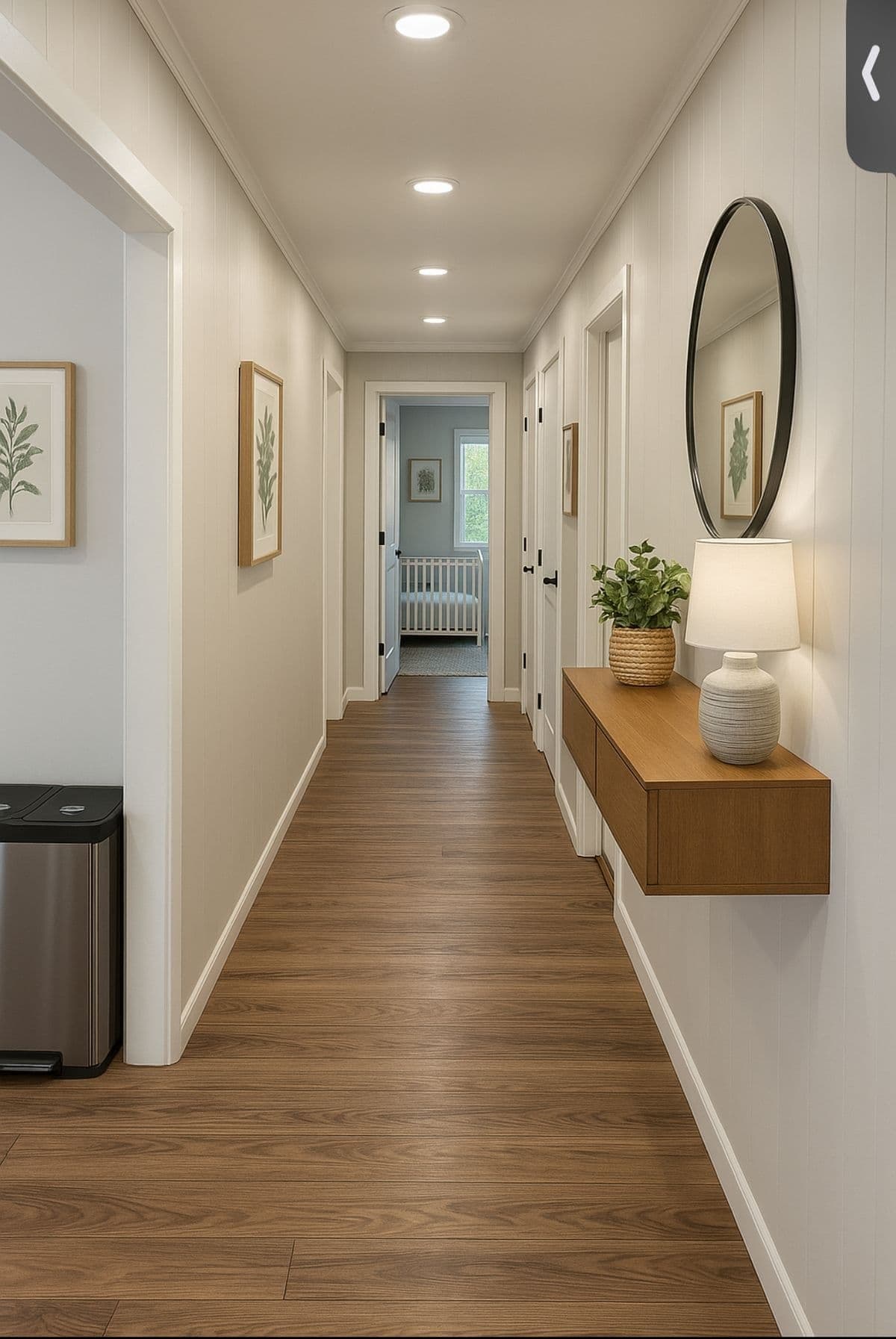 Bright hallway with freshly painted wall panelling, doors and trim