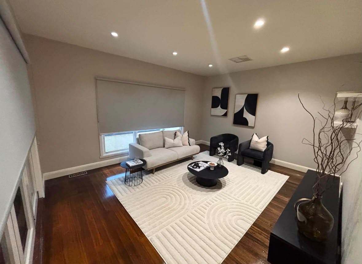 Refreshed formal lounge with neutral walls and white trim