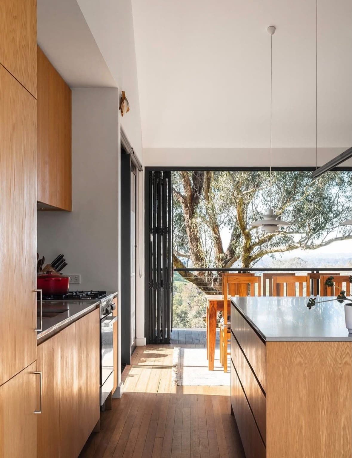 Timber kitchen framed by freshly finished light walls and ceiling