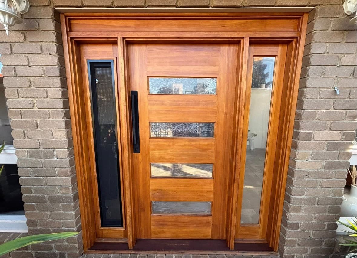 Restored timber front door and matching glazed side panels